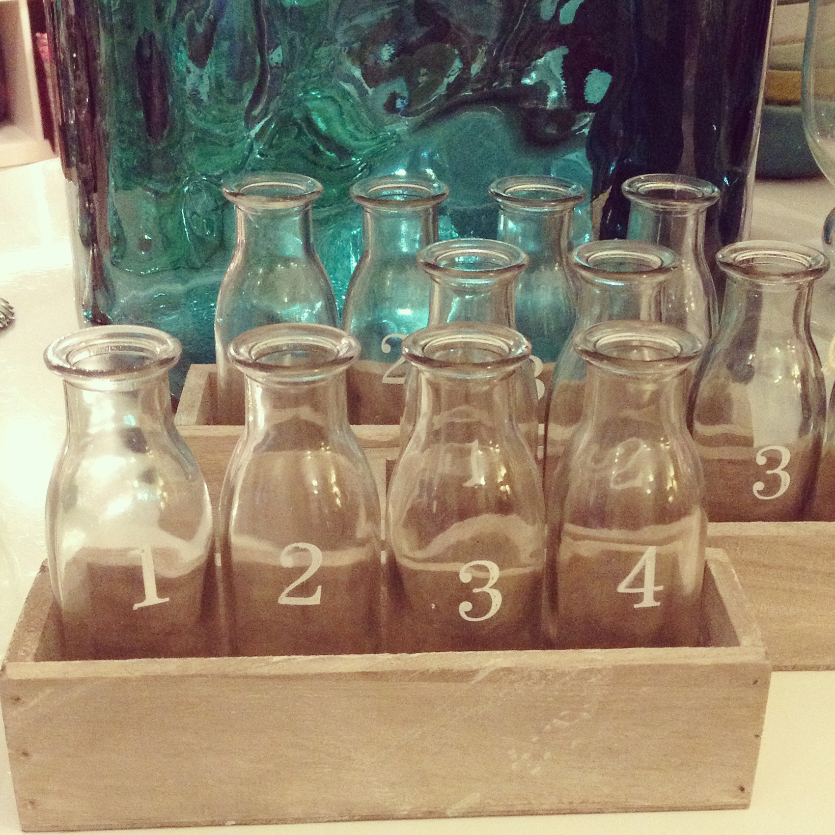 Tray with four numbered bottles