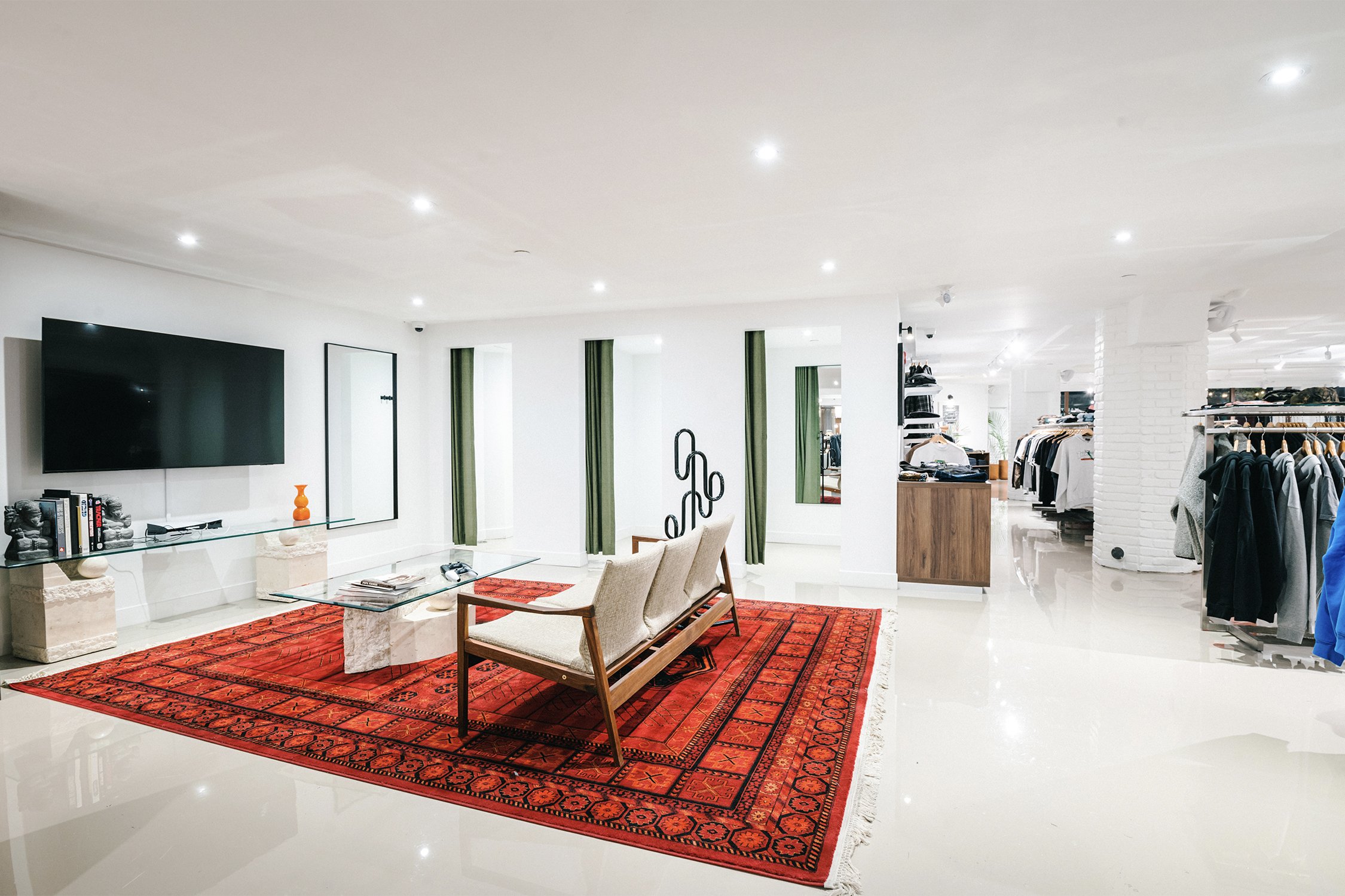 Lounge area integrated into Empire flagship retail store, featuring curated furniture and custom interior layout by Finkel'