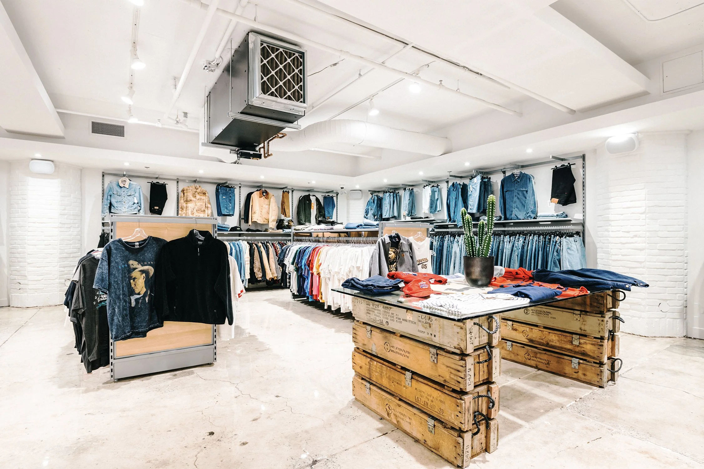 Retail merchandising area with clothing displays designed by Finkel' for Empire’s flagship store