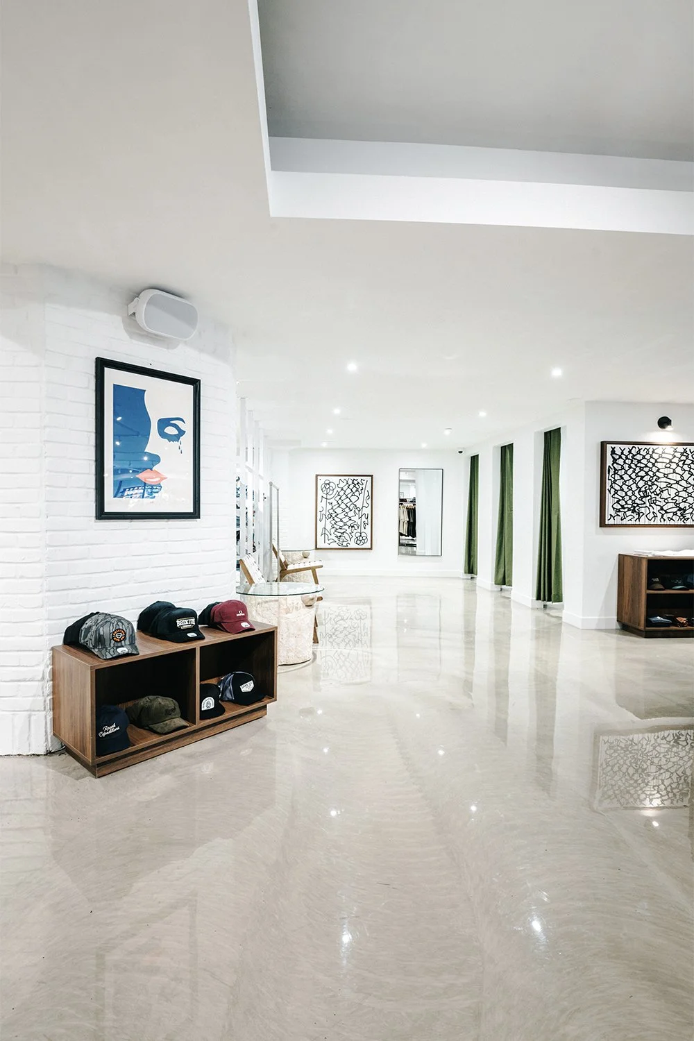 Open retail circulation and custom wall display designed by Finkel' for Empire’s flagship store