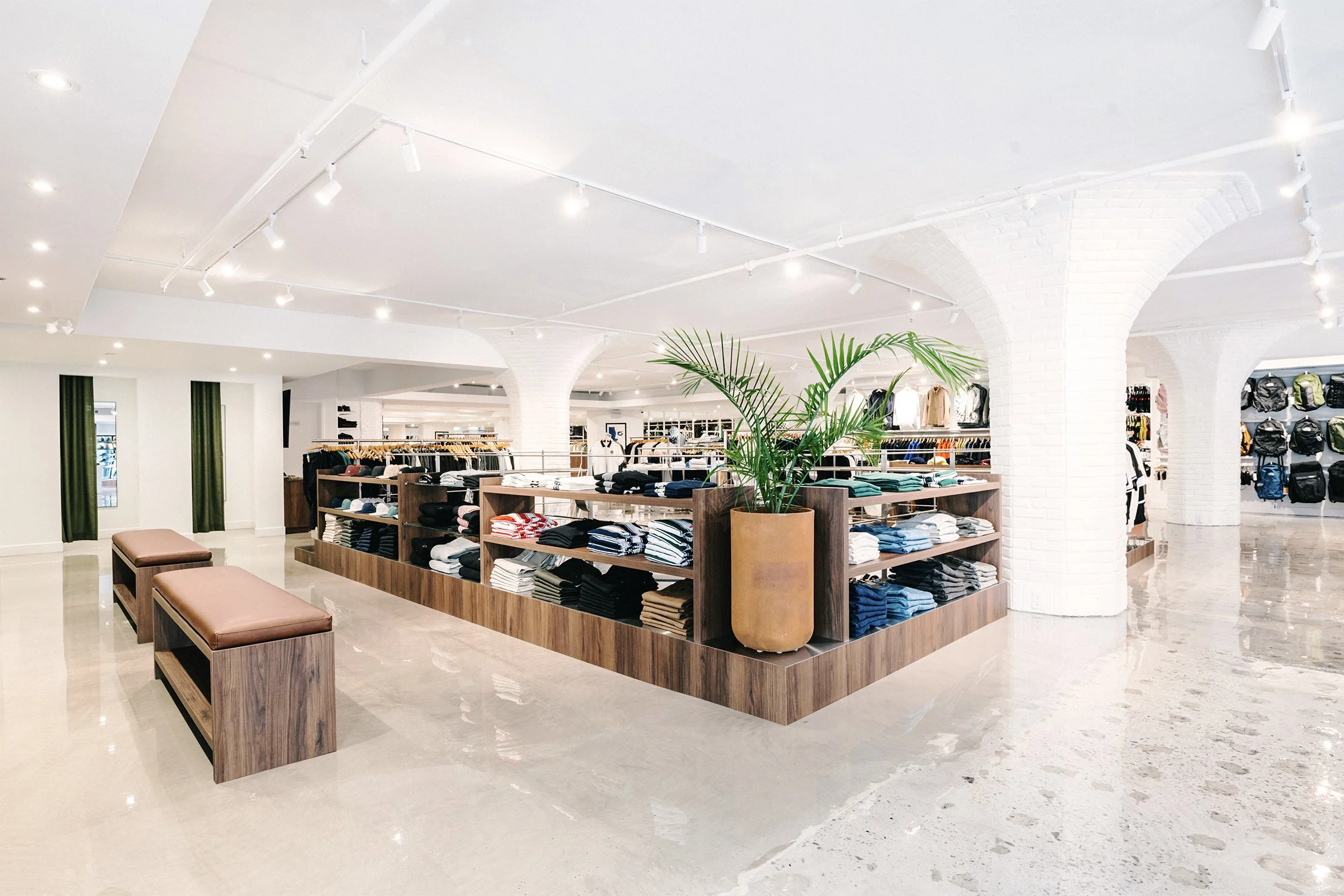 Large-scale retail floor with central merchandising islands designed by Finkel' for Empire’s flagship store