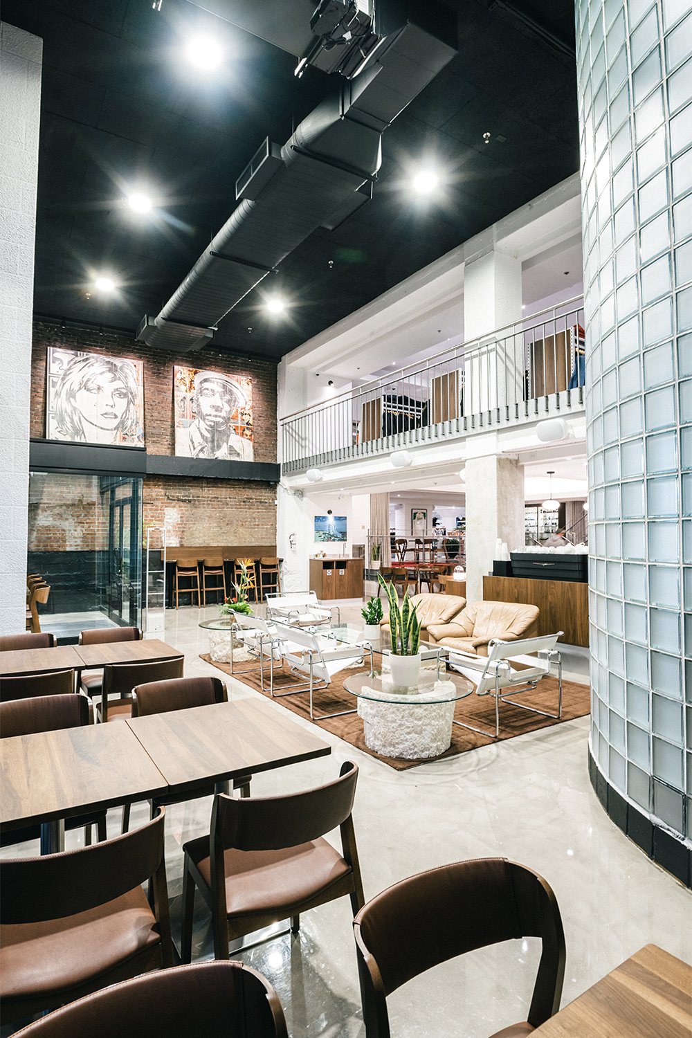 Empire café interior designed by Finkel showing double-height lounge seating, café tables, and furnishings