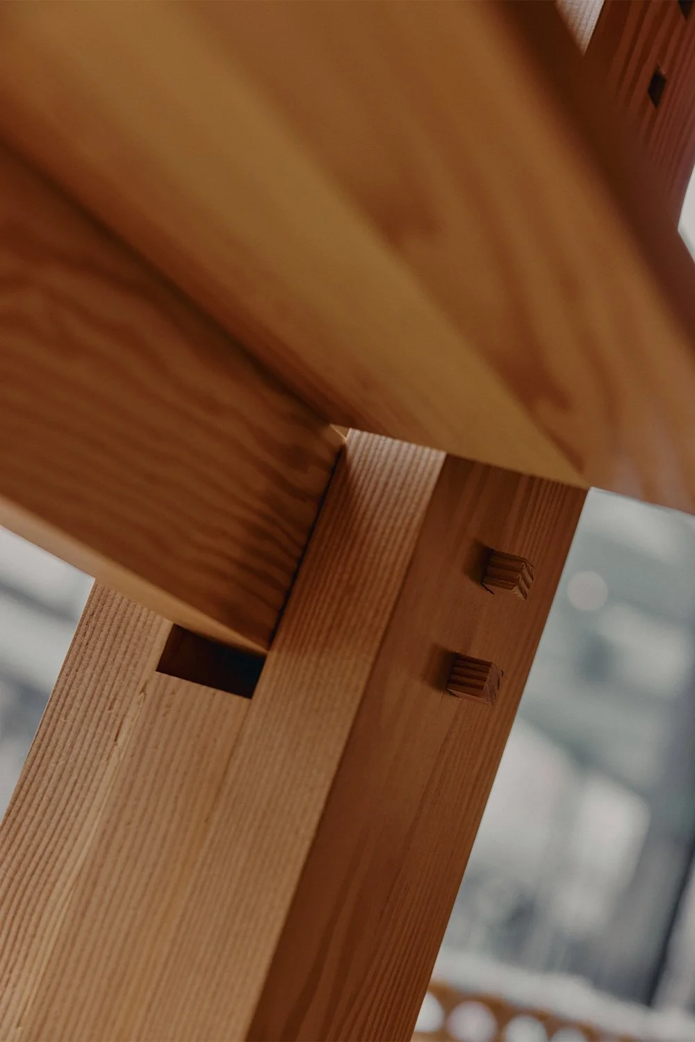 Traditional Japanese joinery detail in custom wood furniture designed by Finkel.