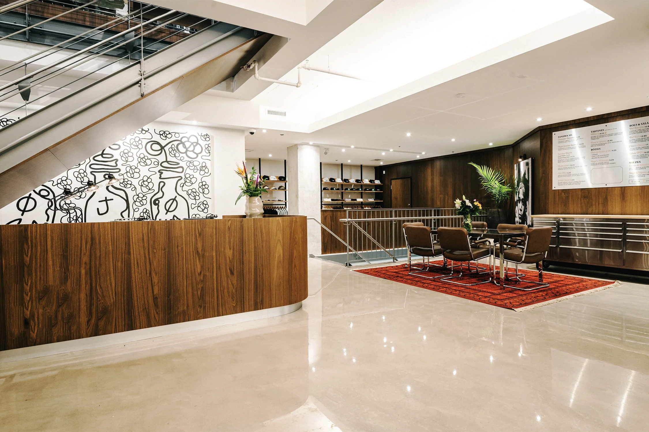 Retail circulation and seating area beneath staircase designed by Finkel' for Empire’s flagship store