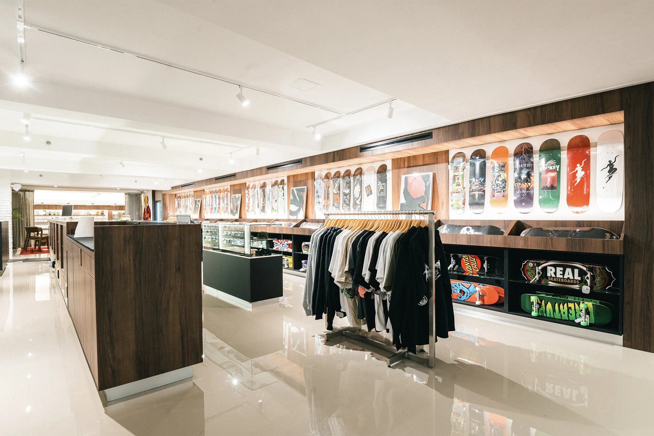 Custom retail wall and product display designed by Finkel', integrating skateboard decks and apparel within the Empire flagship store