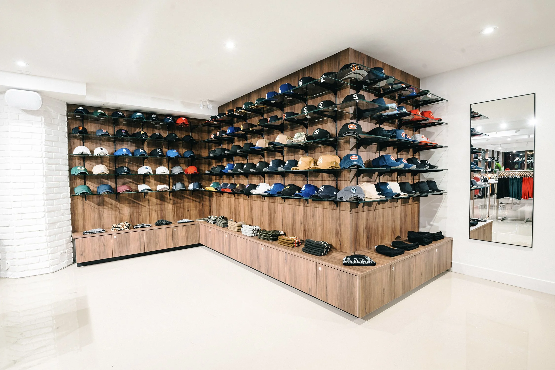 Hat merchandising wall and retail display system designed by Finkel' for Empire’s flagship store
