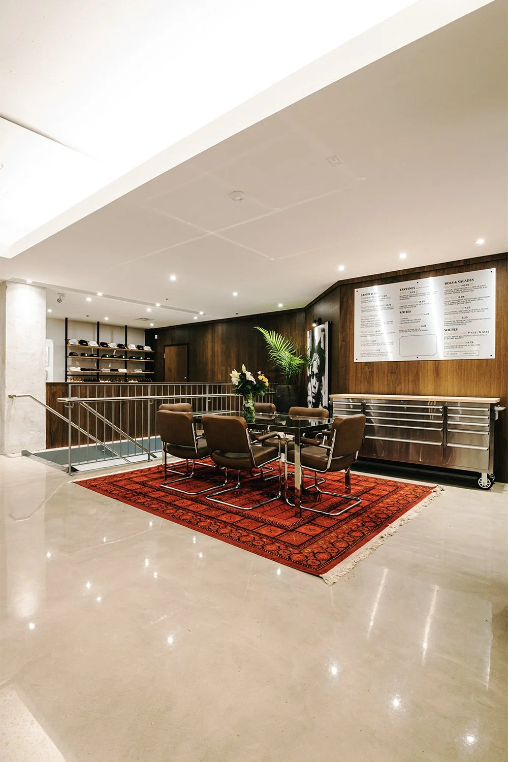 Seating area within Empire café designed by Finkel, featuring custom furniture, wood millwork, and a warm hospitality interior