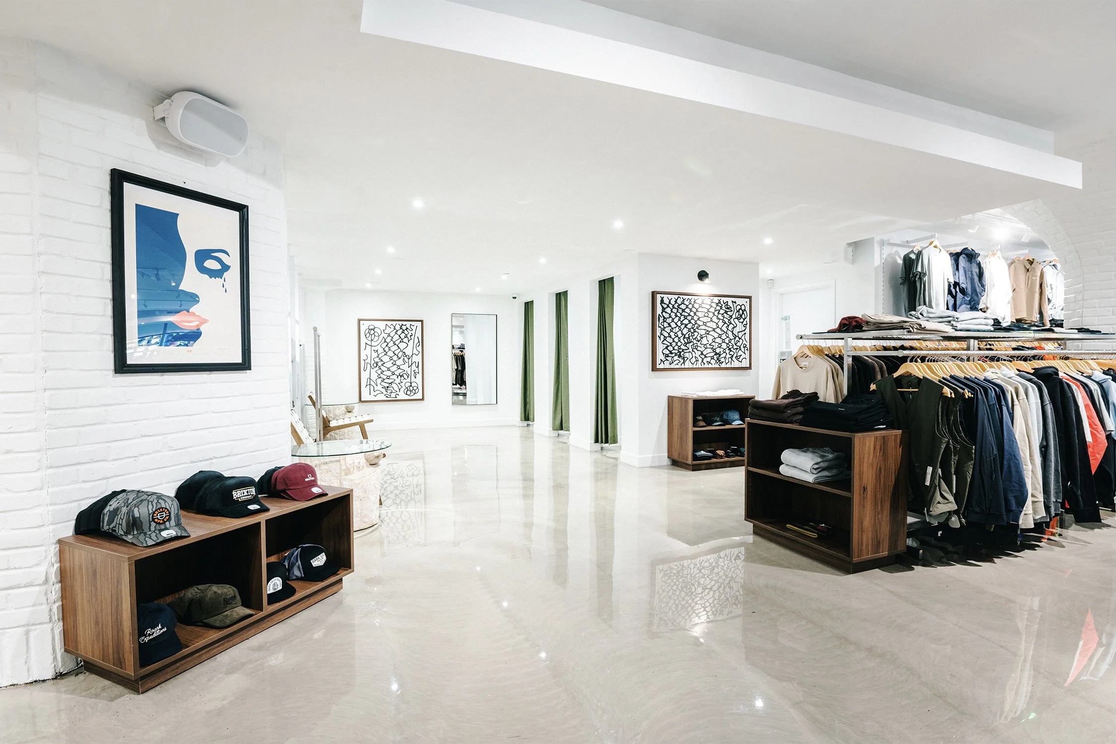 Empire flagship retail interior designed by Finkel' featuring custom wood fixtures, open circulation, and minimalist commercial design