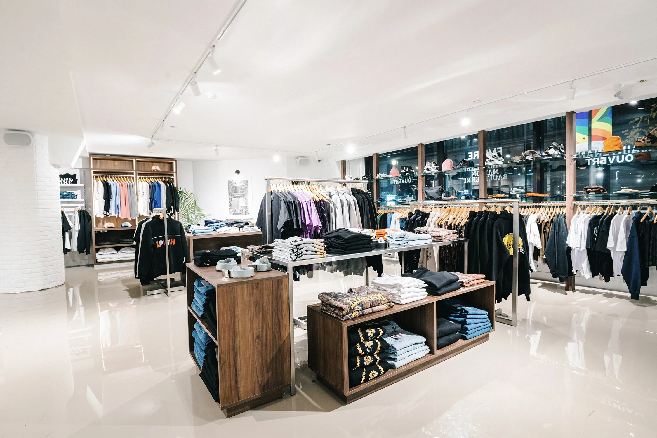 Custom merchandising tables and apparel displays designed by Finkel' for Empire’s flagship retail store