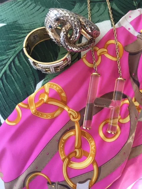 Here are some of Natalie’s favorite A+M purchases from over the years. A 1980's Celine silk blouse, a Ciner bangle from the 1980s, a lucite “H” necklace, and a snake bangle. All of the jewelry is from her favorite NYC dealer, Deluxe Twentieth Century.
