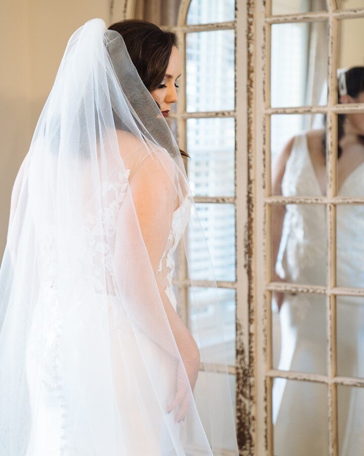 Quiet moments are generally few and far between on wedding days, but this is one I always love. Those final minutes before we head off to the ceremony when the bride takes one last glance in the mirror.  It's a centering moment.  Time slows down just