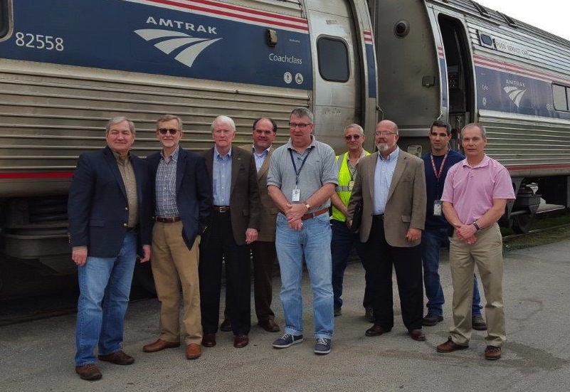John Spain, left, John Robert Smith, Dick Hall, Knox Ross, Joe McHugh, an Amtrak employee, Greg White, a second Amtrak employee and Bill Hollister pose outside an Amtrak train during the trip. John Spain, Knox Ross and Greg White are members of the Southern Rail Commission’s executive committee, Dick Hall is the Mississippi Central District Transportation Commissioner, and Joe McHugh and Bill Hollister are with Amtrak.