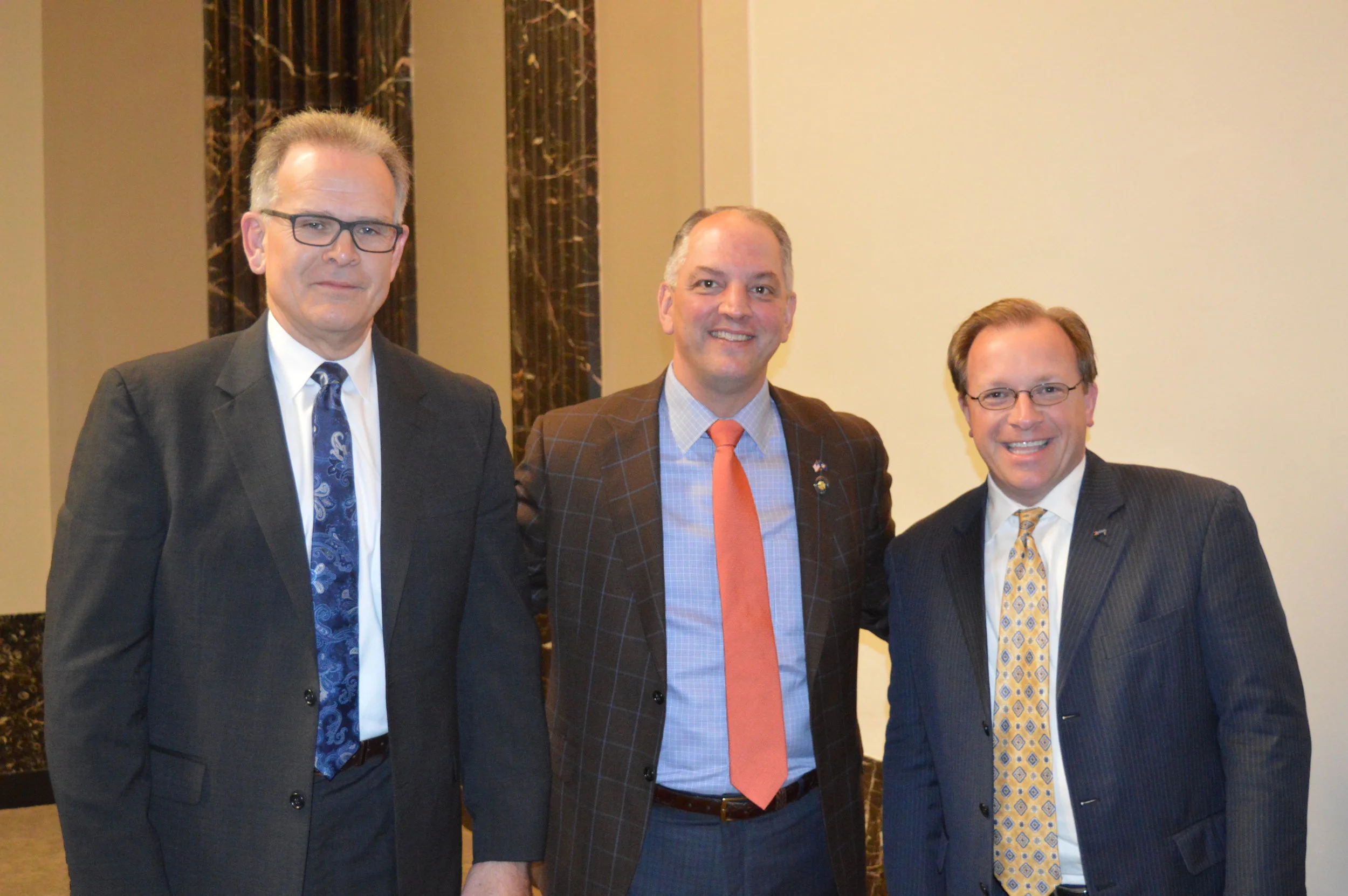 Louisiana Governor John Bel Edwards (center) with Amtrak's Vice President, Long Distance Services Business DevelopmentMark Murphy (left) and Director of Government Affairs-South Todd Stennis (right)