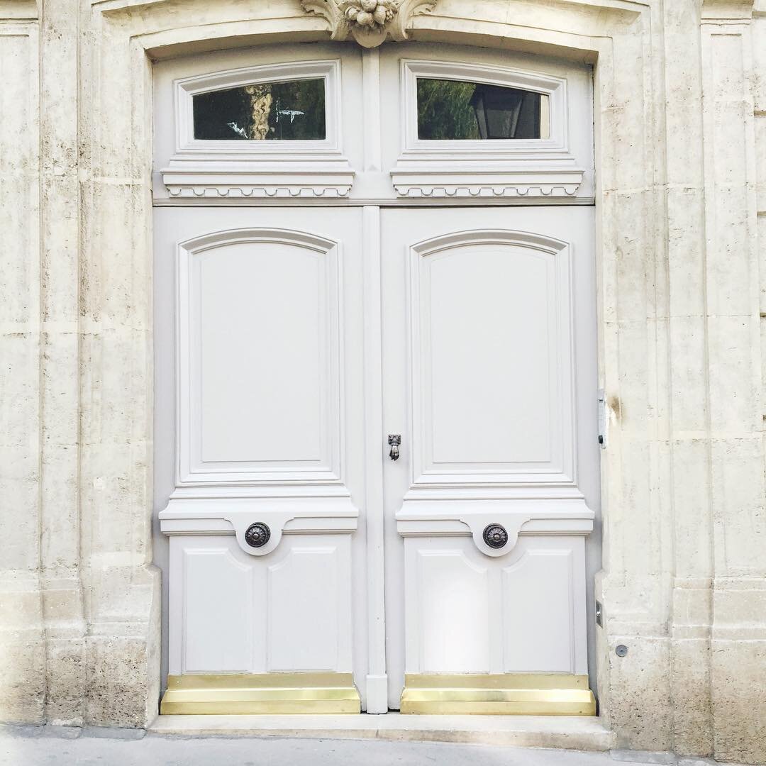 The magical doors of Paris. (Equally magical: the little door knocker is a tiny iron hand.)