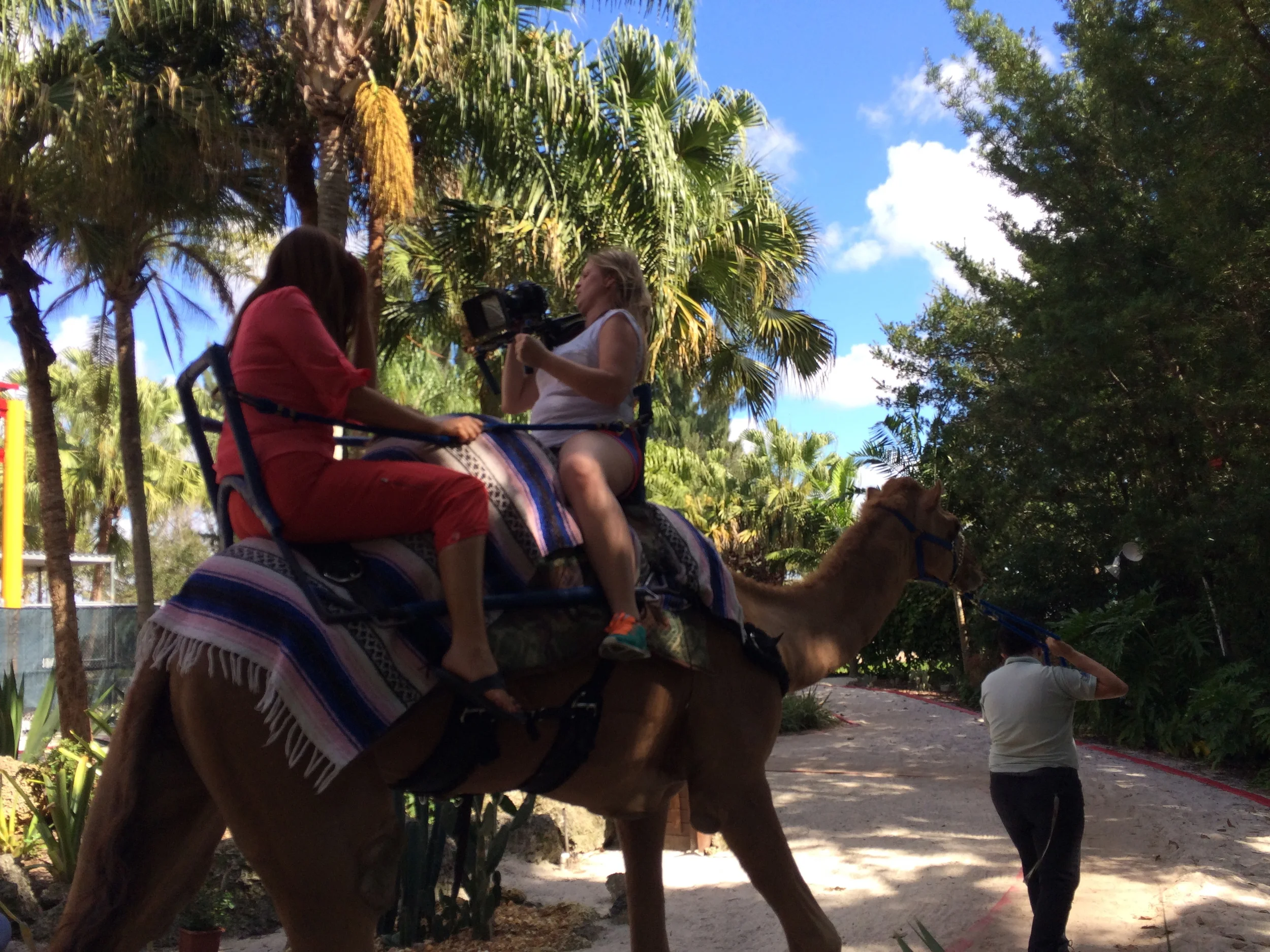 Riding a camel while filming for Discover America
