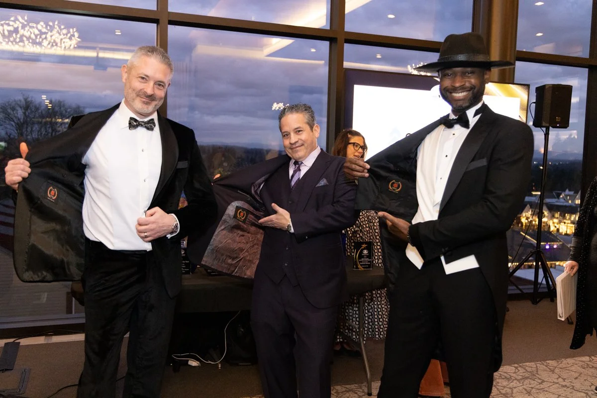 Portland area event photography showing candid crowd interaction at a Lake Oswego venue