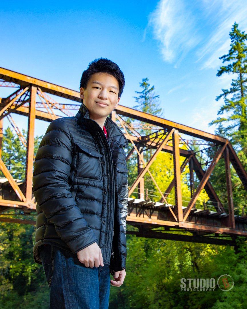 Male high school senior portrait urban bridge Tualatin Oregon.