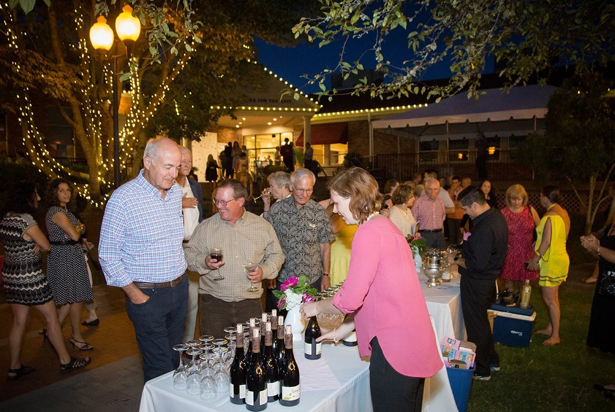 Portland Metro event attendees engaged in conversation, photographed candidly by Studio B Photography