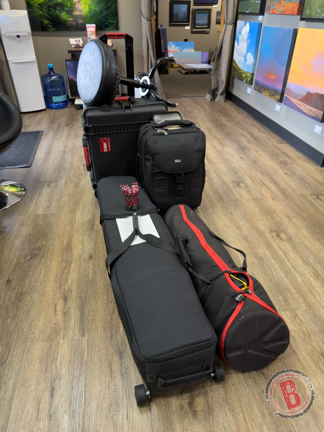 Photography lighting and camera equipment packed for on-location studio headshots in Portland office setting.