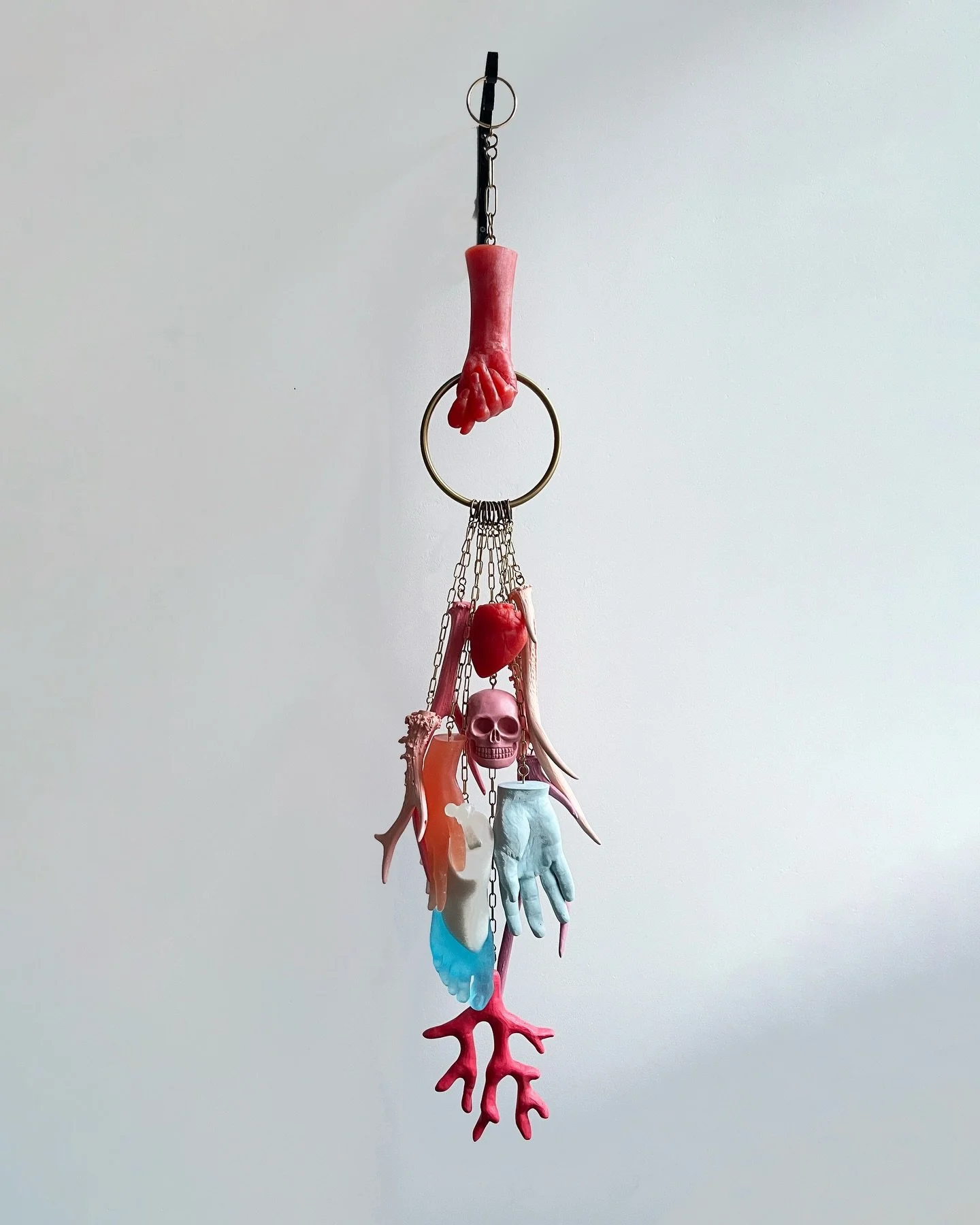 MEDUSA&rsquo;S TEARS
2025

Medusa&rsquo;s Tears is a ritual object for a dying world.
 A sculptural bundle of oversized apotropaic charms, including the Italian mano figa, corno and symbols drawn from feminist ritual and resistance, it glows in coral