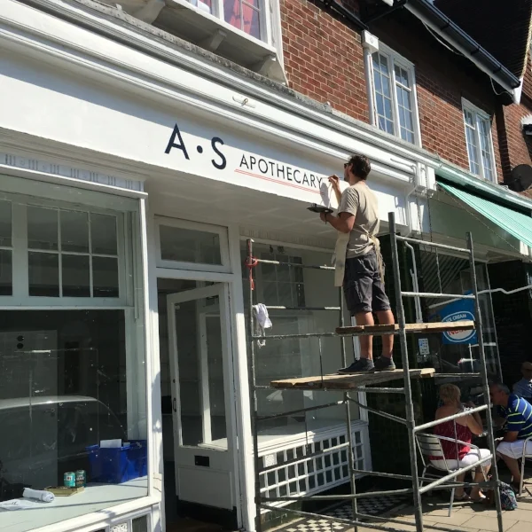 Keith Pettit painting the name above our new shop