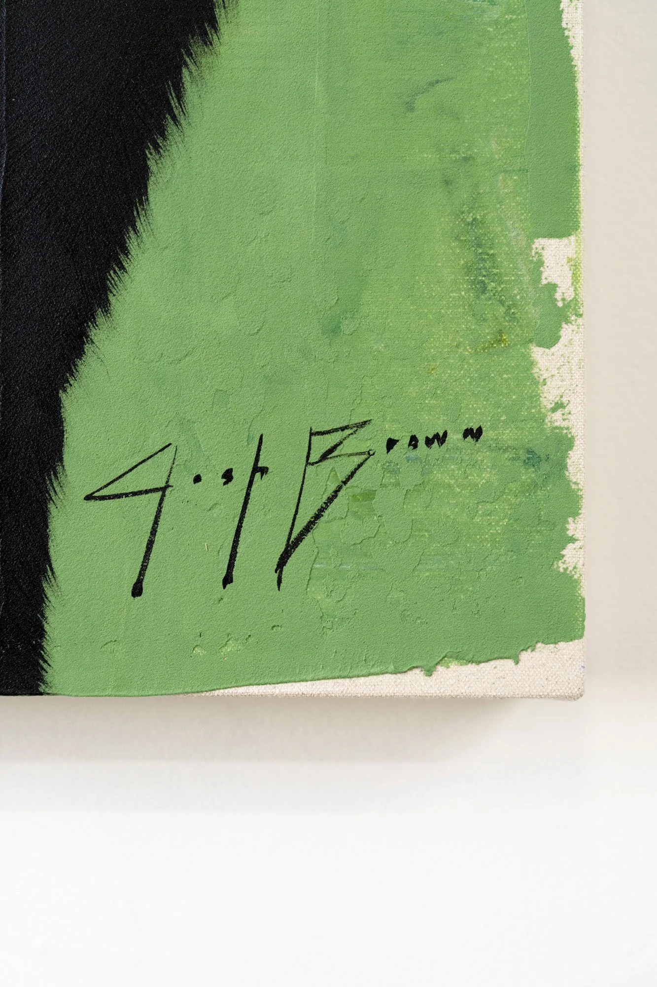Close-up of expressive black brushwork contrasted against vibrant green paint in a modern animal artwork with the artist's signature by Josh Brown.
