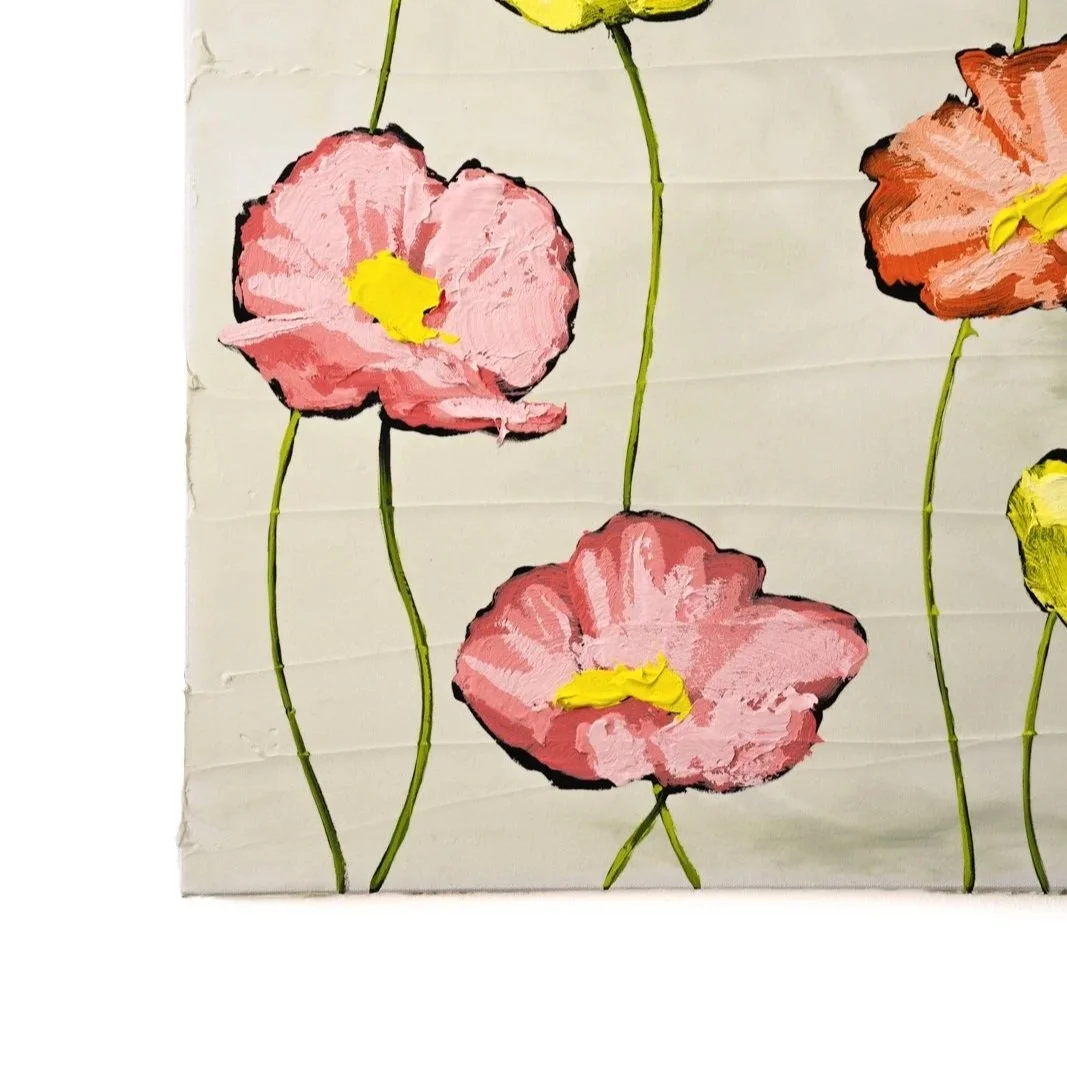 Minimalist floral painting with expressive flowers arranged on a pale sage canvas highlighting the corner of a painting by Josh Brown.