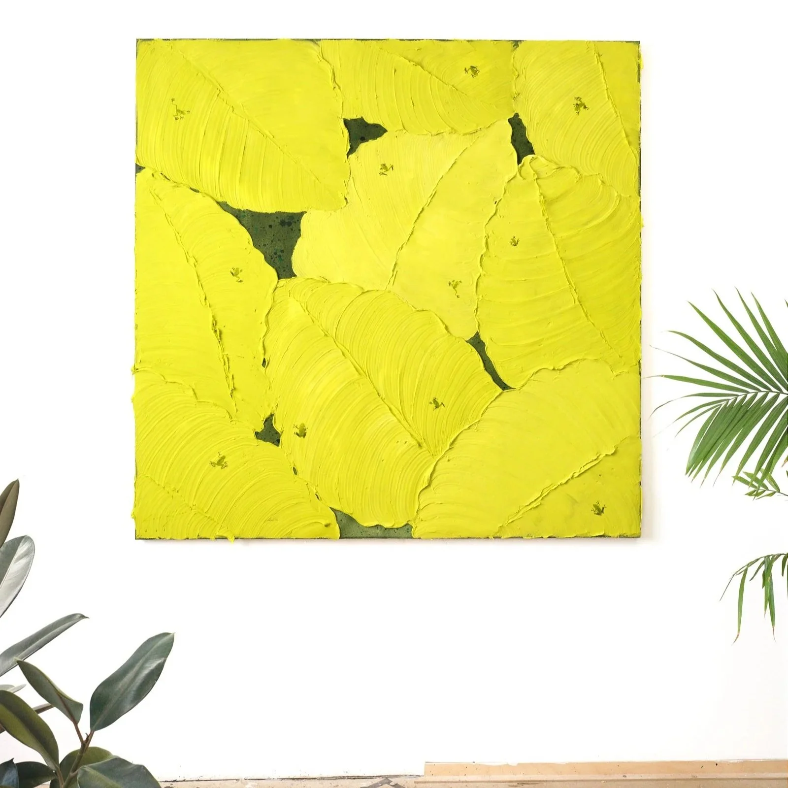 Detail of thick yellow acrylic leaves layered across a square canvas, showcasing bold texture and contemporary abstract style by Josh Brown.