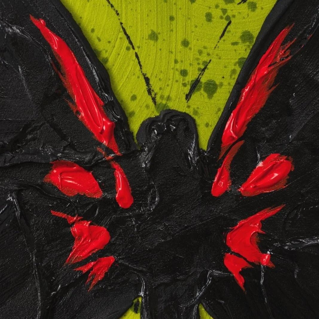 Detail view of layered acrylic brushstrokes creating dramatic wing shapes in a modern butterfly artwork with red, black, and a green background by Josh Brown.