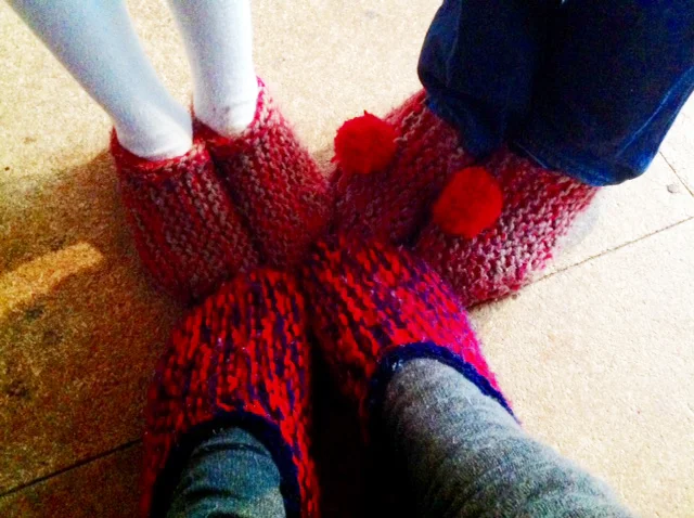 The kids and I in our Ces Slippers. Other designs use two pairs of old socks stitched together, with cardboard between the layers on the soles...
