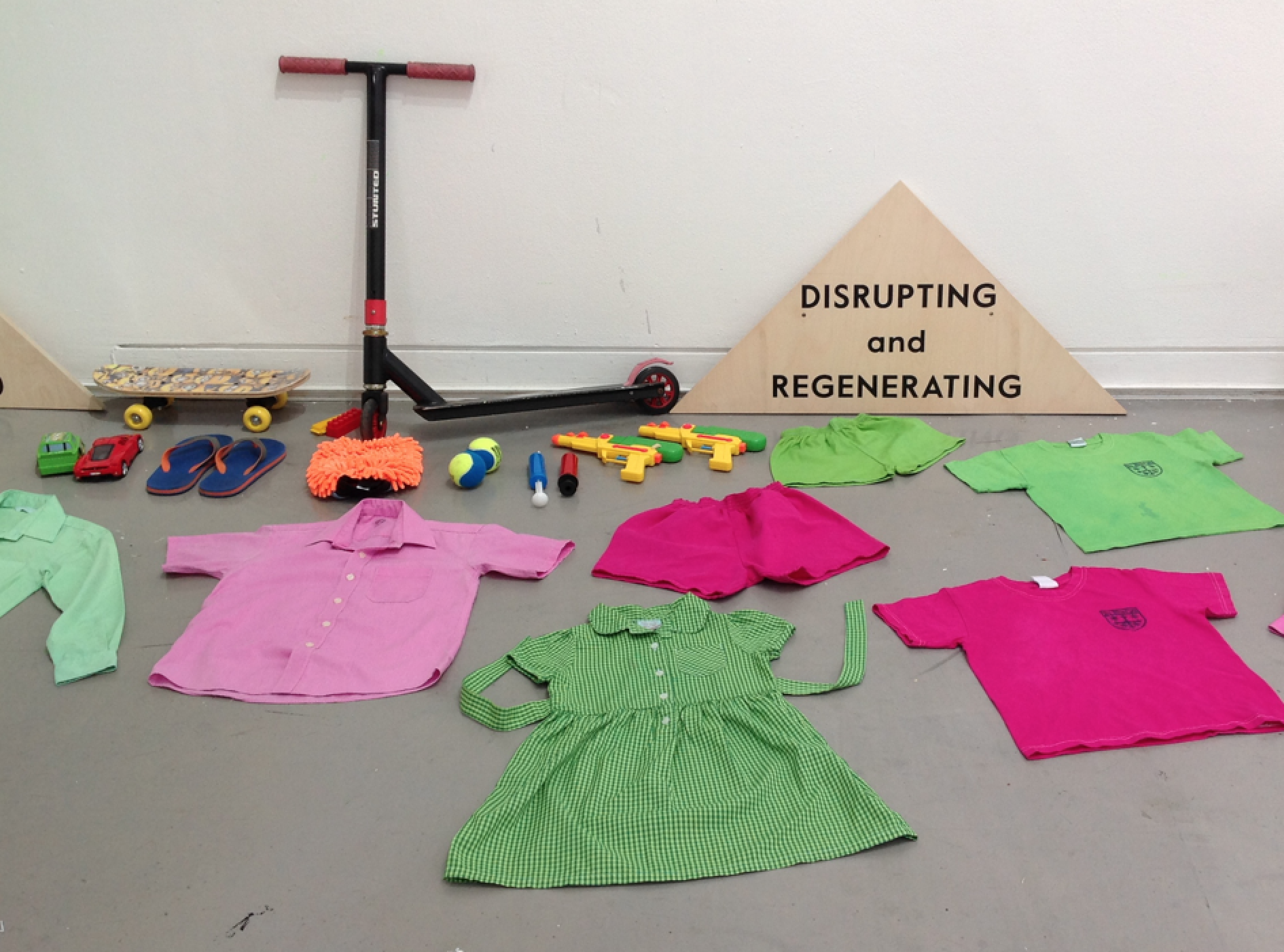 Toys as tools. Dirty white stained and ripped uniform becomes pink and green after a Dylon wash at home. (I put some towels and other t-shirts in to use up the dye)...