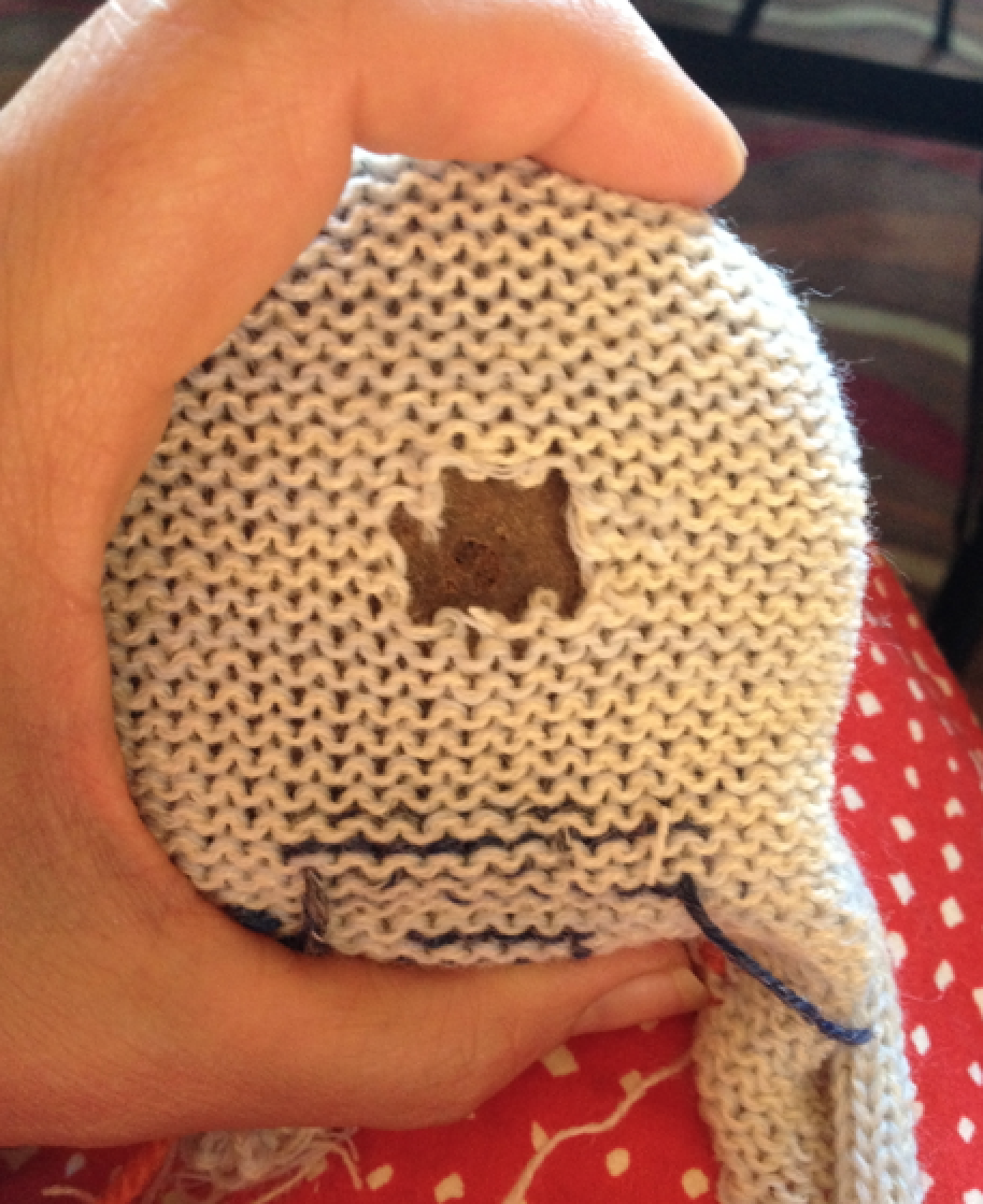 Tom made a hole for us to mend. A small snip quickly unravels into a bigger hole on the mushroom.