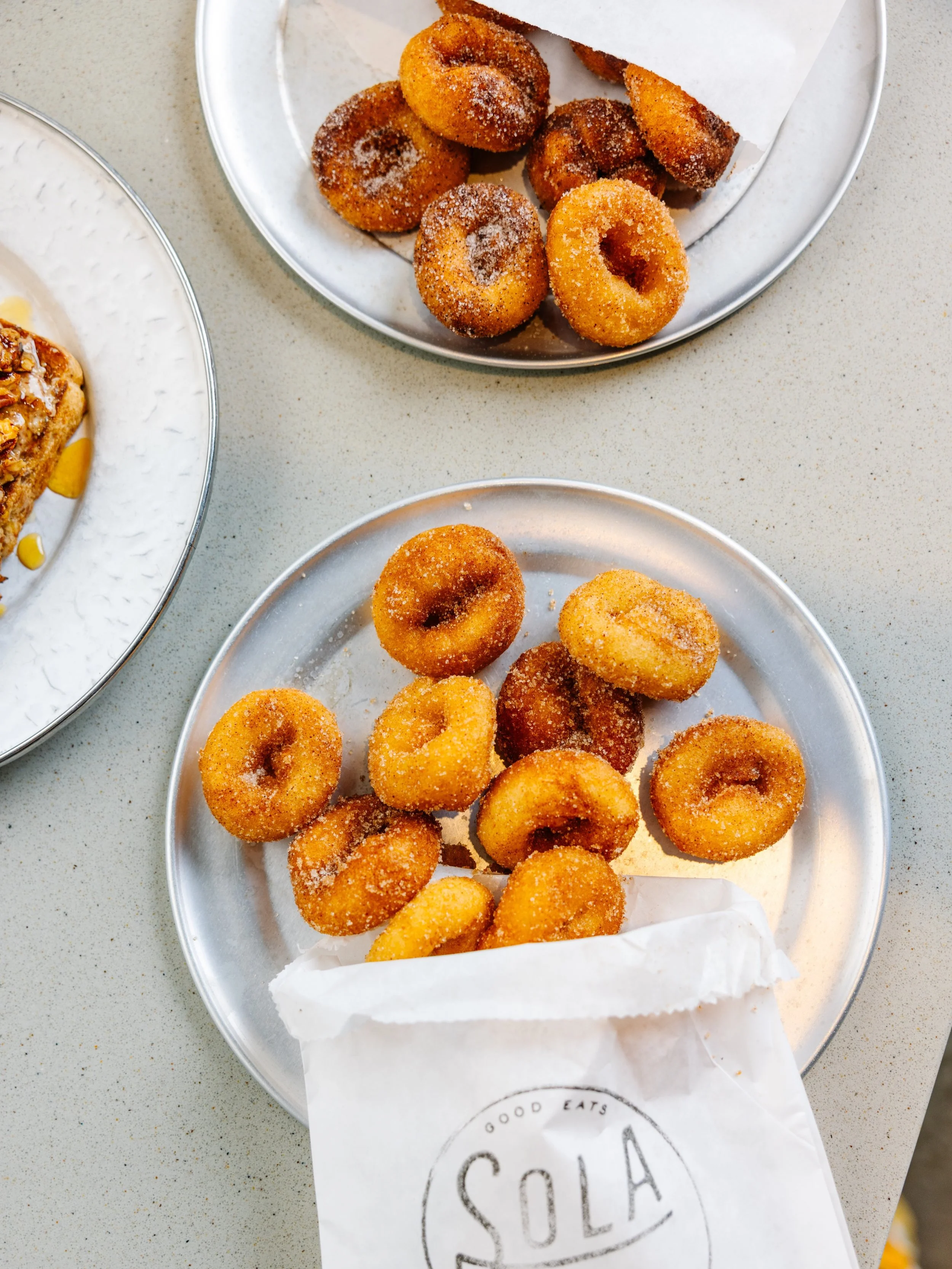 Everyday is donut day at Sola!!!! Made fresh to order, tossed in your favorite sugar &amp; enjoyed best in large quantities especially on national donut day 😜