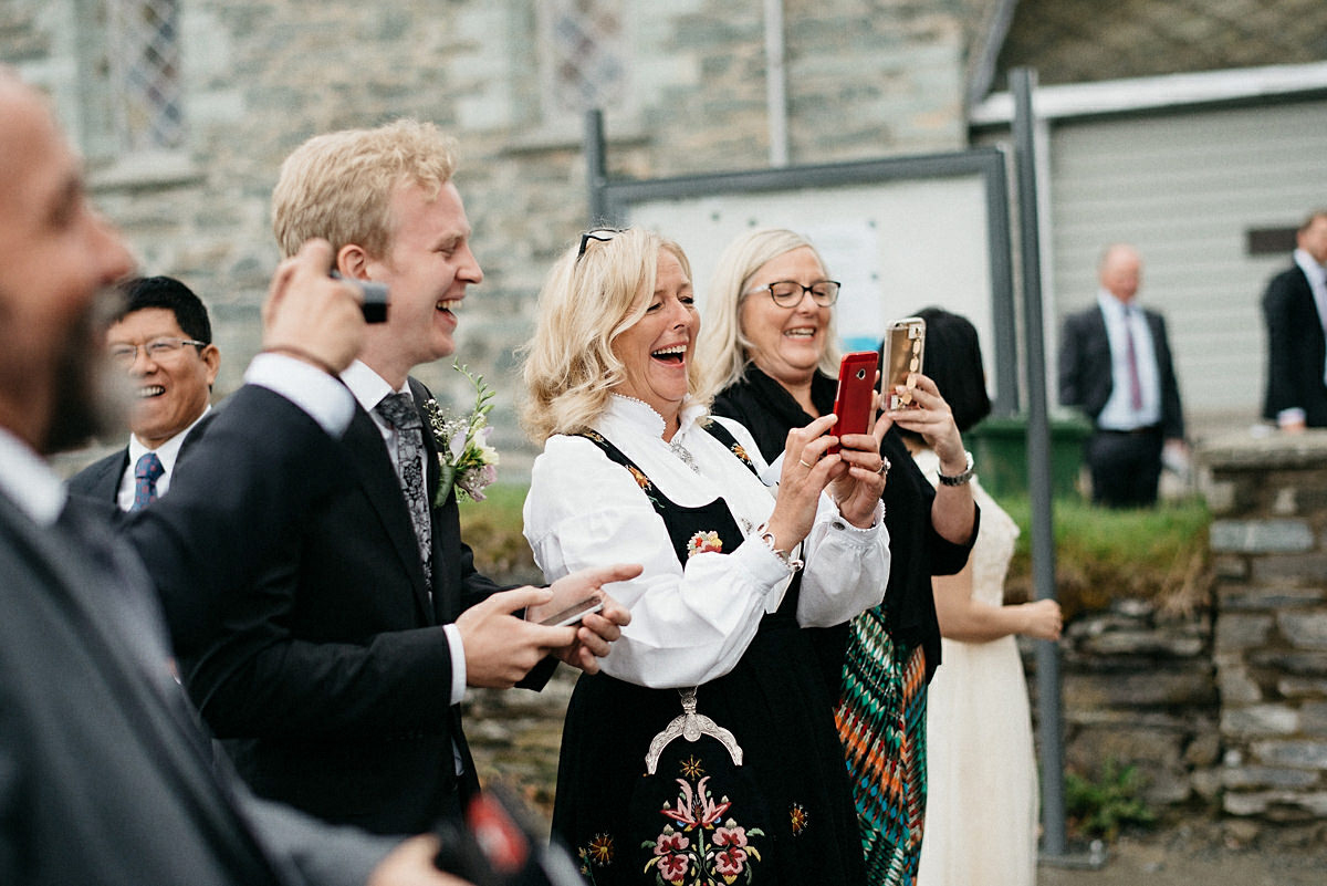 Wedding guests taking pictures