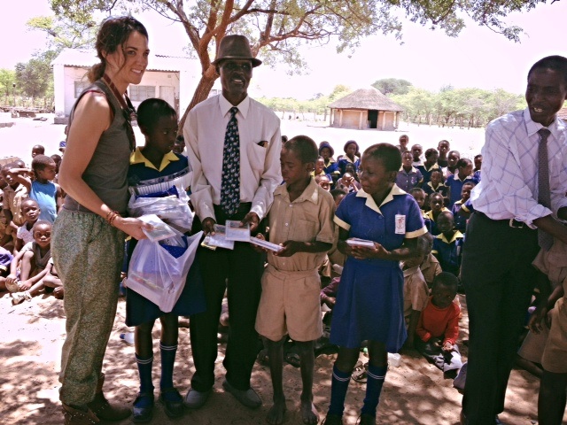   Carla, one of our dental safari volunteers, donating school supplies to a local school during our annual Mobile Dental Safari.  