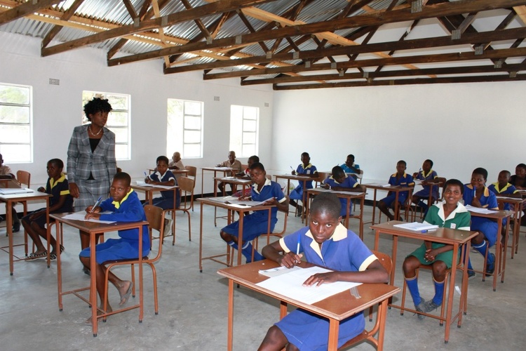   Grade 7 Girls writing exams in their new classroom.  