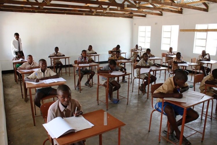   Grade 7 Boys writing exams in their new classroom.  