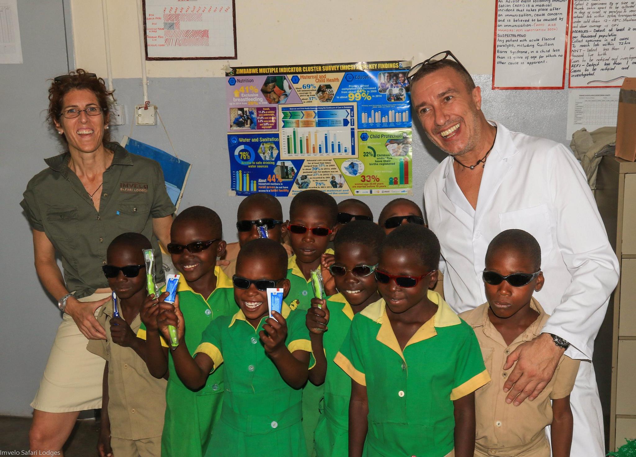  Kids with their new glasses and dental products. 