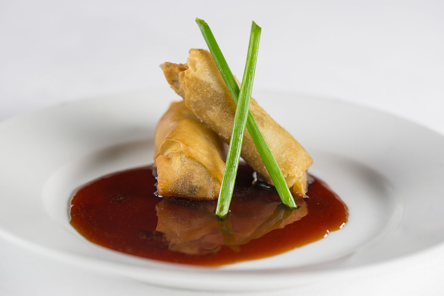 Baby Back Rib Meat Spring Rolls, flash fried, Cheerwine reduction
