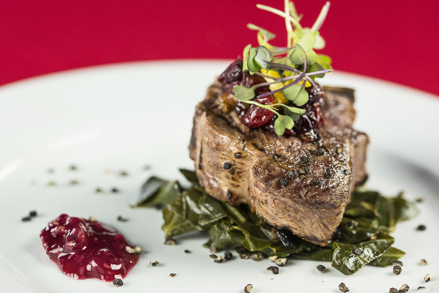 Seared Lamb Chop, slow cooked greens, cranberry jam