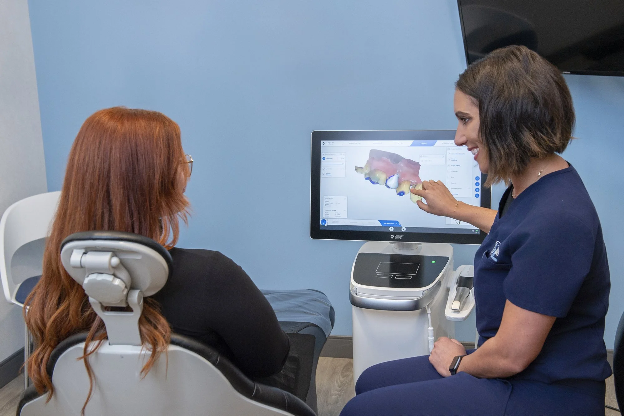 Nurse monitoring patient in ICU room.jpg