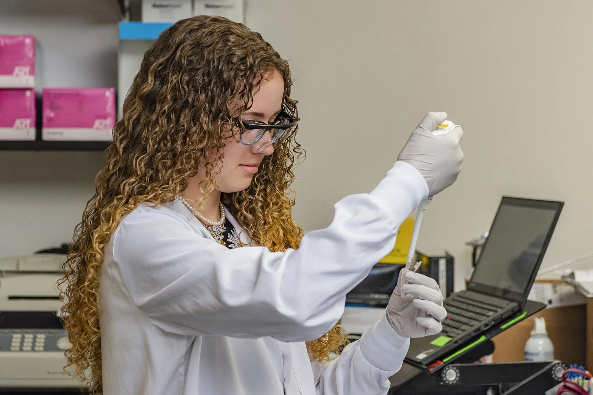 Lab technician handling medical samples.jpg