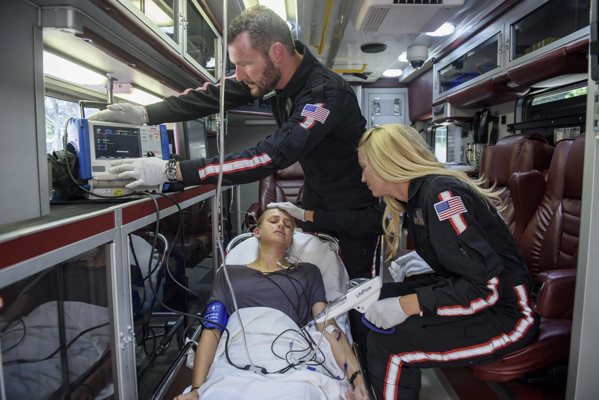 Doctor examining patient in hospital bed.jpg