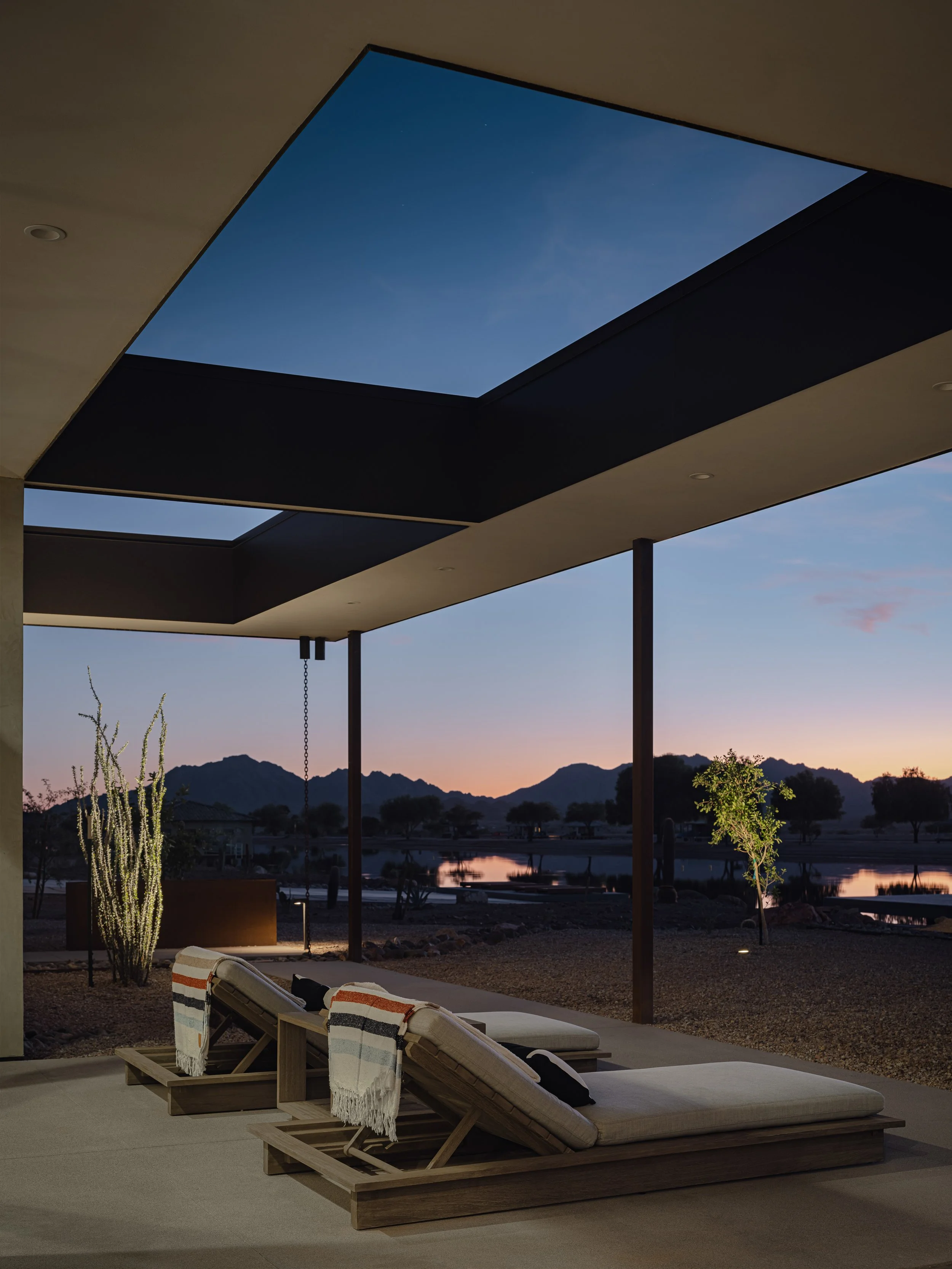 039 ski ranch - twilight rear patio lounges web.jpeg
