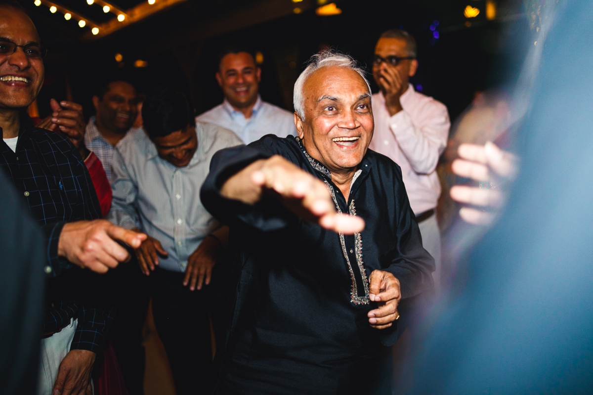 men-dancing-mehndi-ceremony-indian-wedding-photographer_