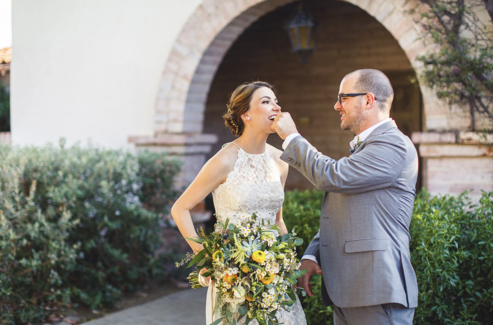 Bride and groom sharing a playful moment during a partial day wedding photography package