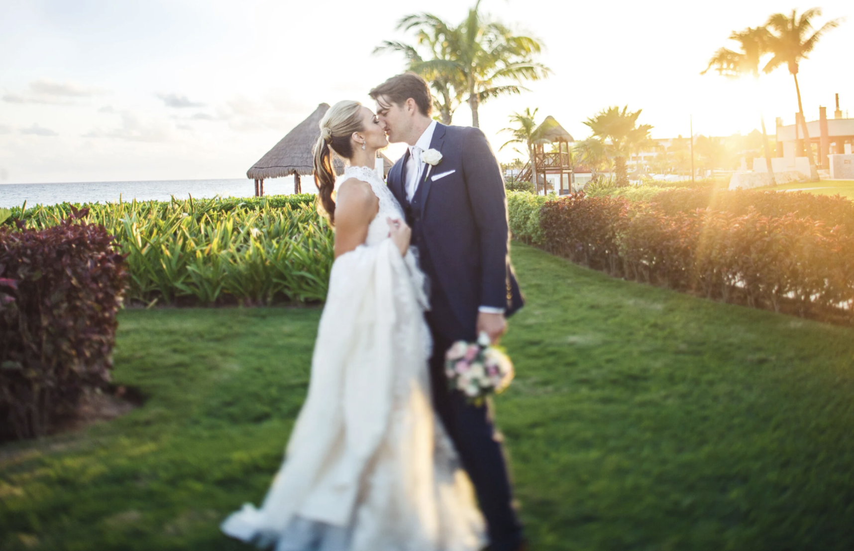 Bride and groom embracing outdoors during a destination wedding weekend photography session.