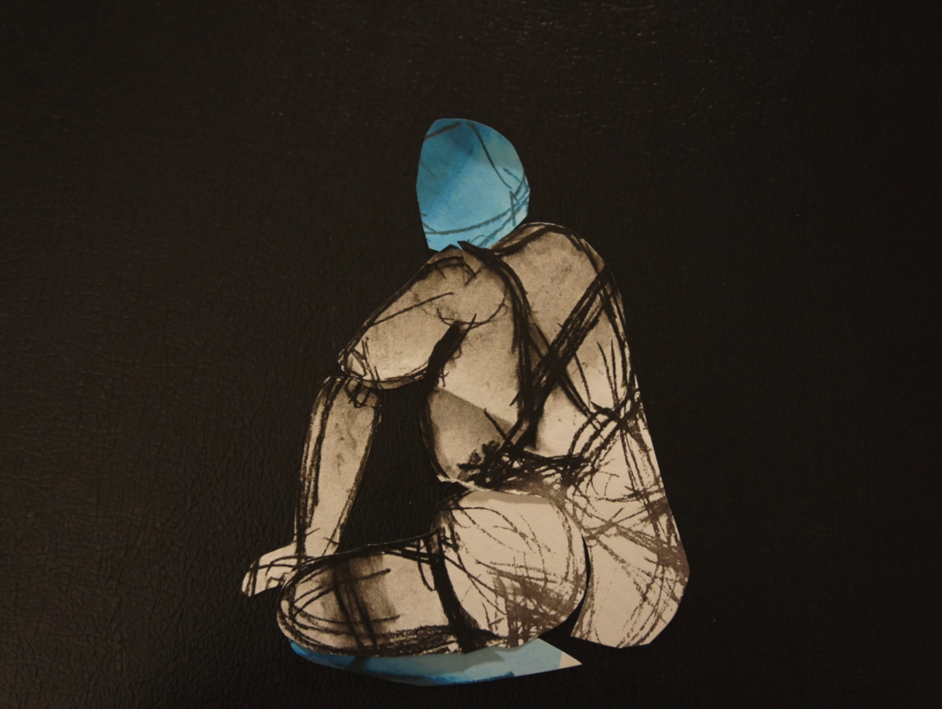 image of a human figure in a sitting posture
