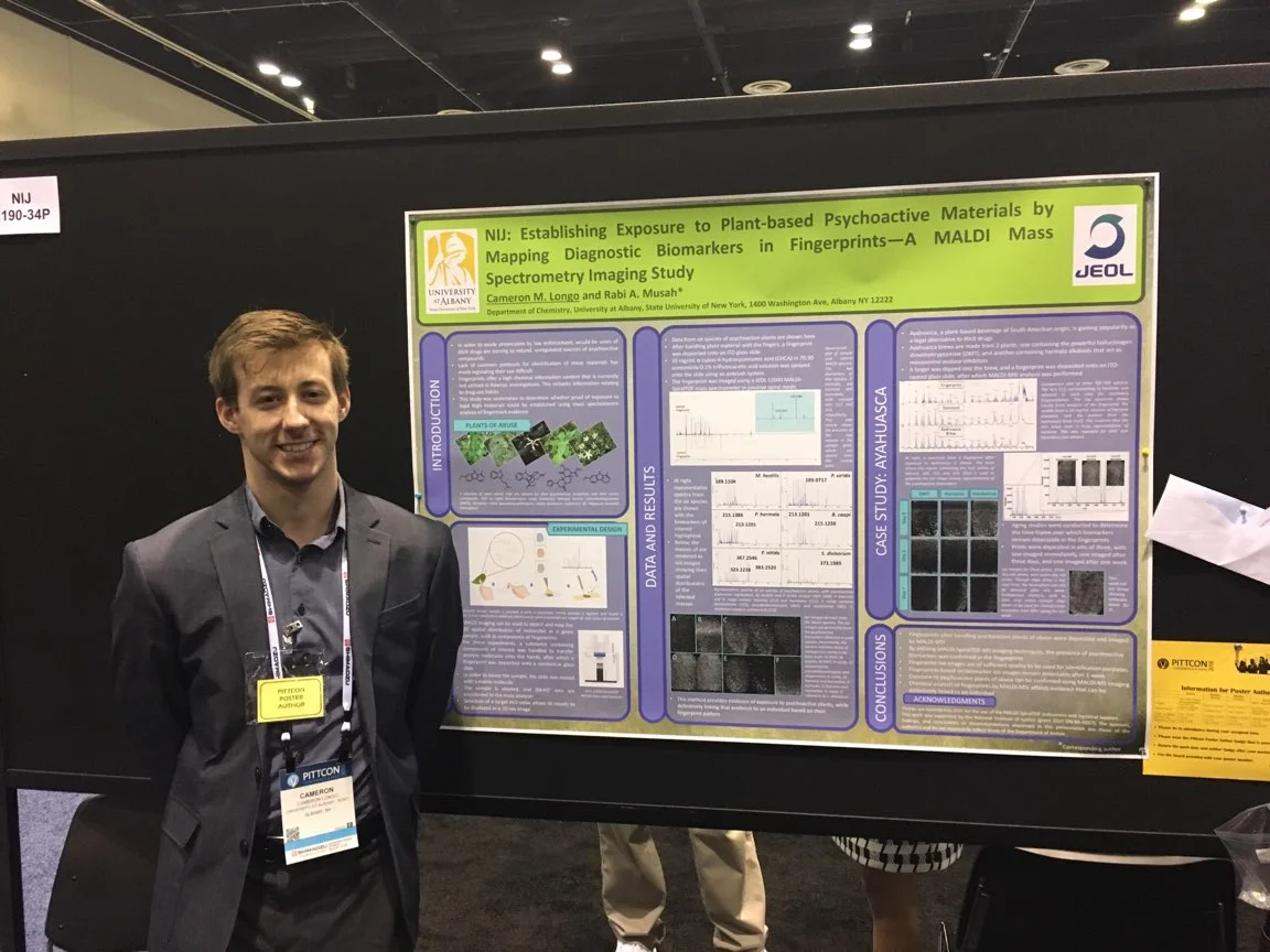 Cameron presenting his poster.