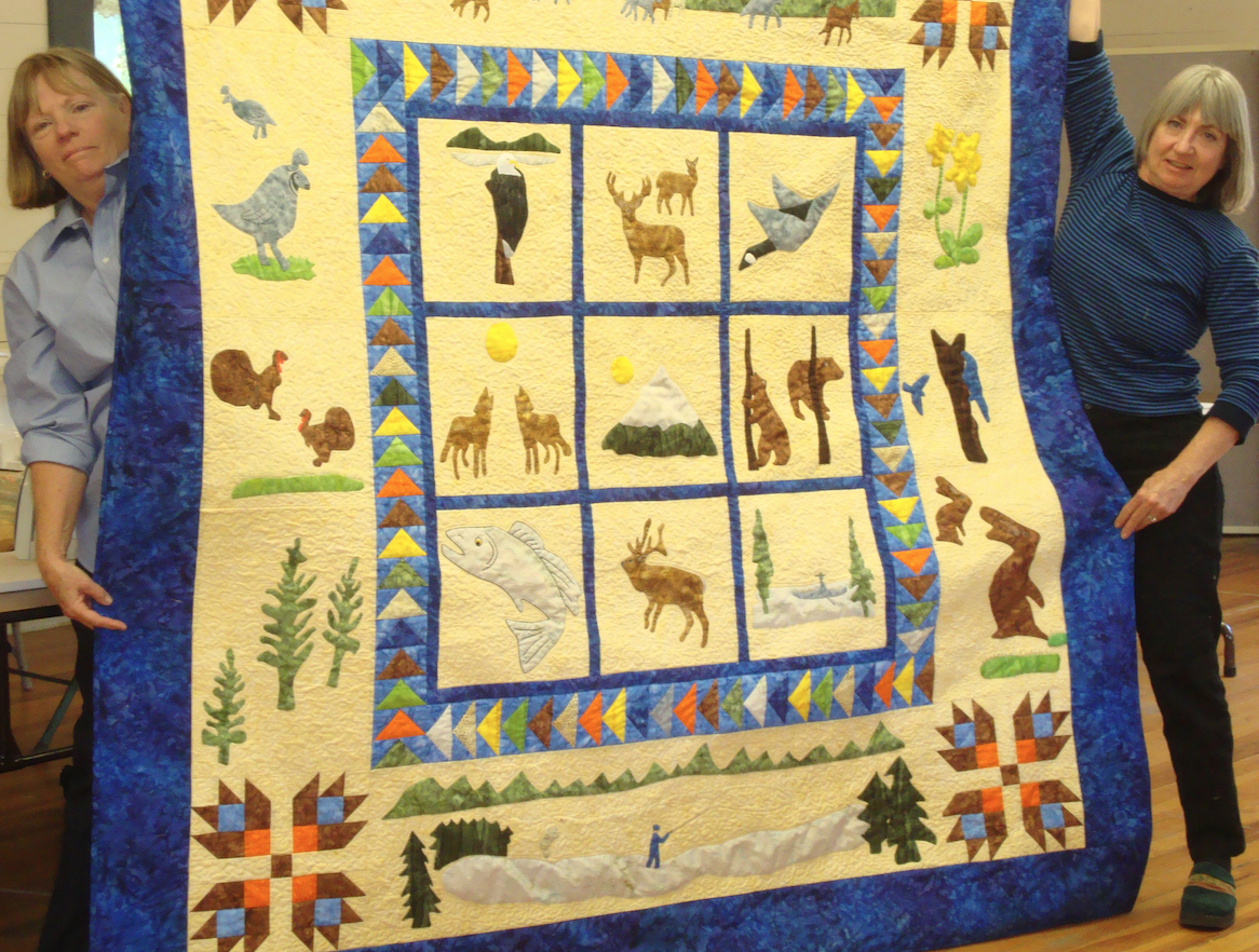 2013 Opportunity Quilt designed by Kaye Burns (right). Hand appliqued by members.